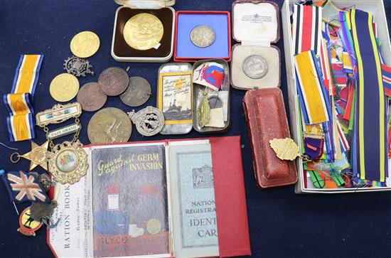 A box of assorted medallions, medal ribbons, etc.